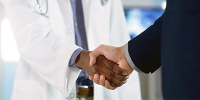healthcare workers shaking hands
