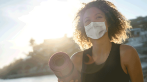 girl with mask and yoga mat