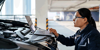 auto worker looking at computer