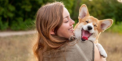 person holding dog