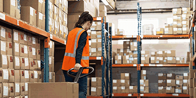 warehouse worker moving boxes