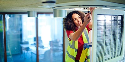 woman fixing vent