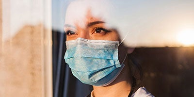 nurse looking at a sunset