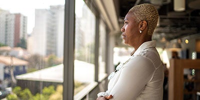 woman looking out window