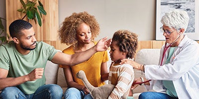 doctor seeing a family 