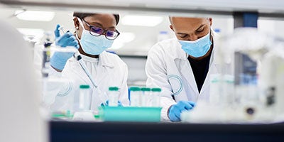 researchers in lab