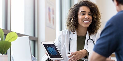 doctor speaking to patients