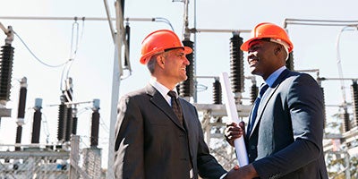 businessmen with hard hats