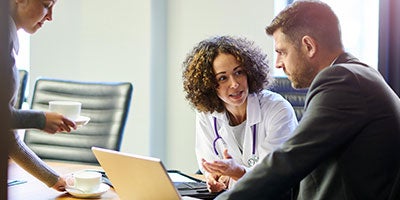 doctor and person in suit 