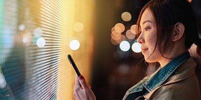 woman looking at phone