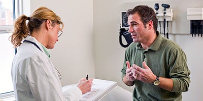 doctor speaking to patient