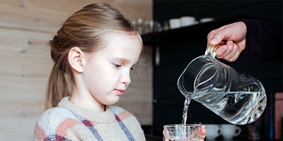 girl receiving water