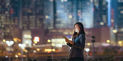 woman in front of city skyline