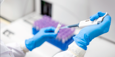 researcher using pipettes