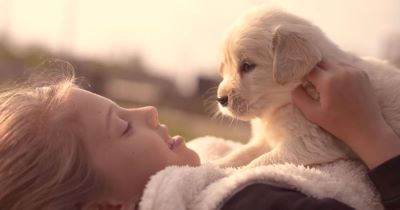woman holding puppy