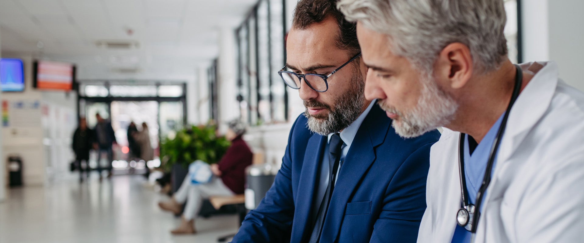 A doctor and patient talking in lobby