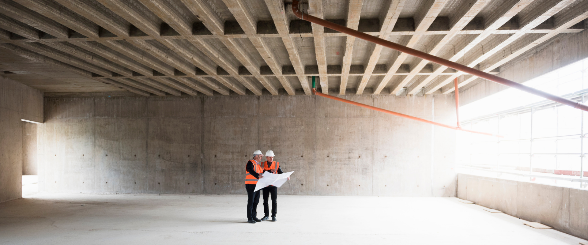 men standing in a building area