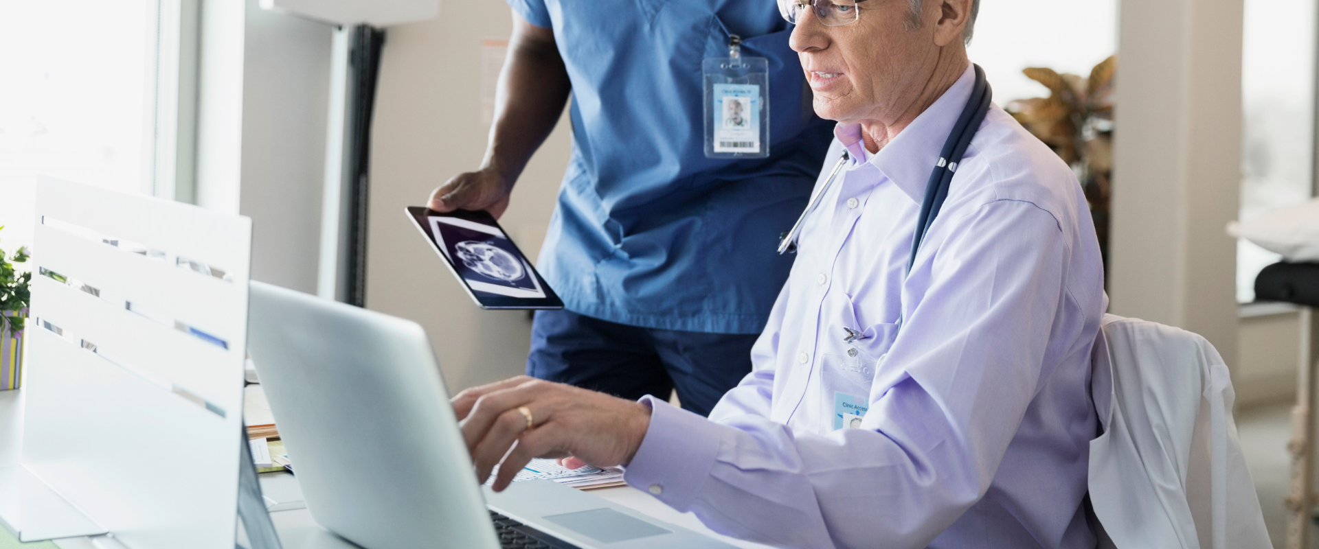 doctor looking at a laptop