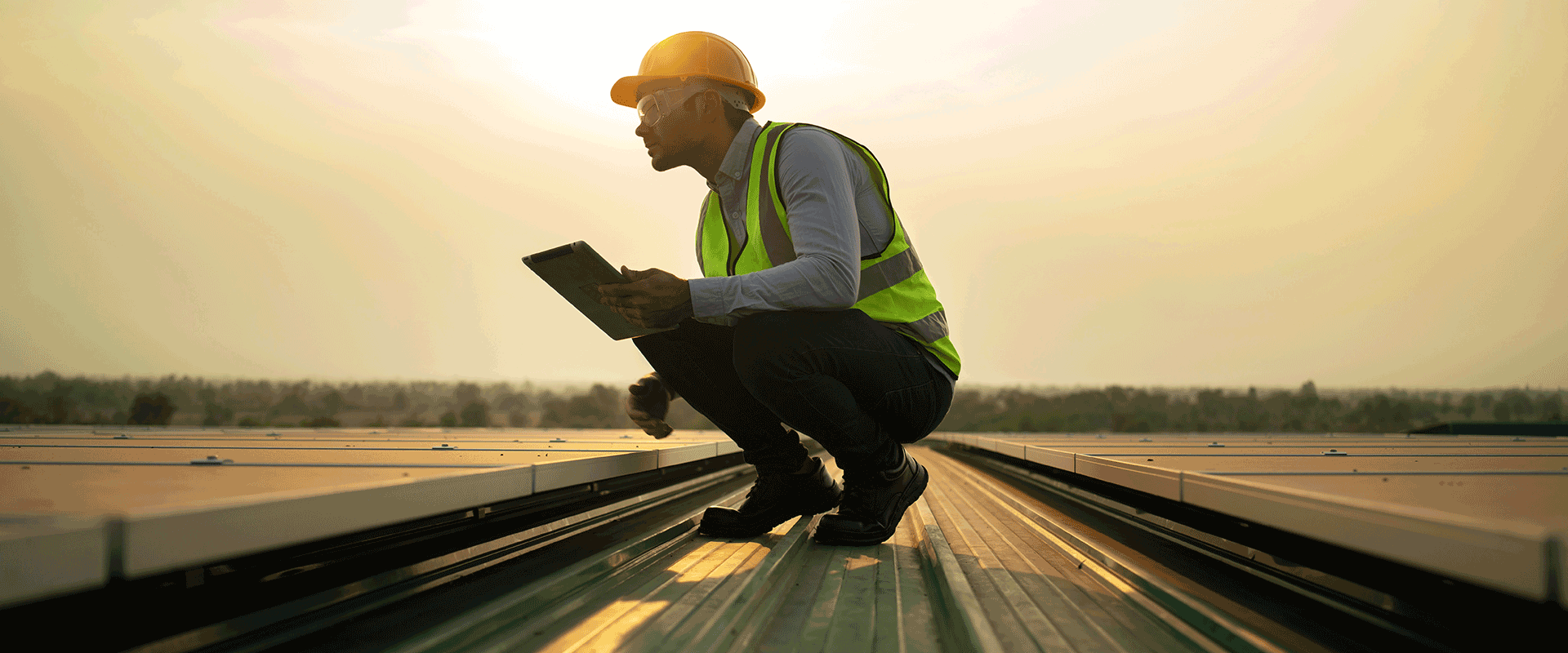 man working on solar panels