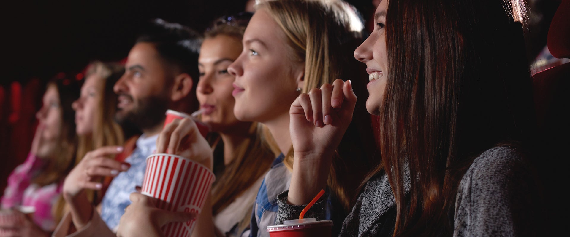 People still watching films in a movie theater