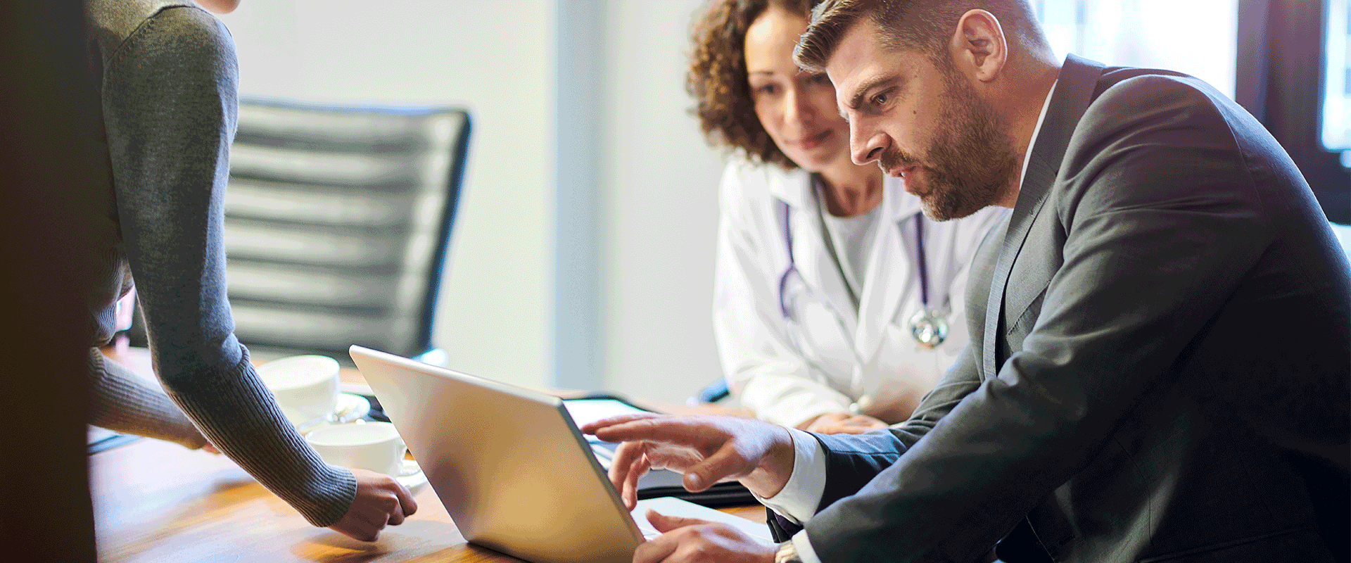 doctor and business person at desk