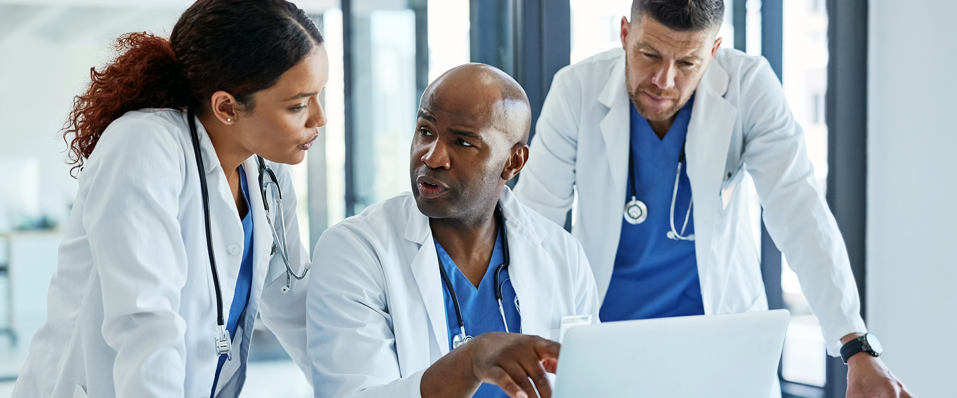 healthcare workers looking at computer