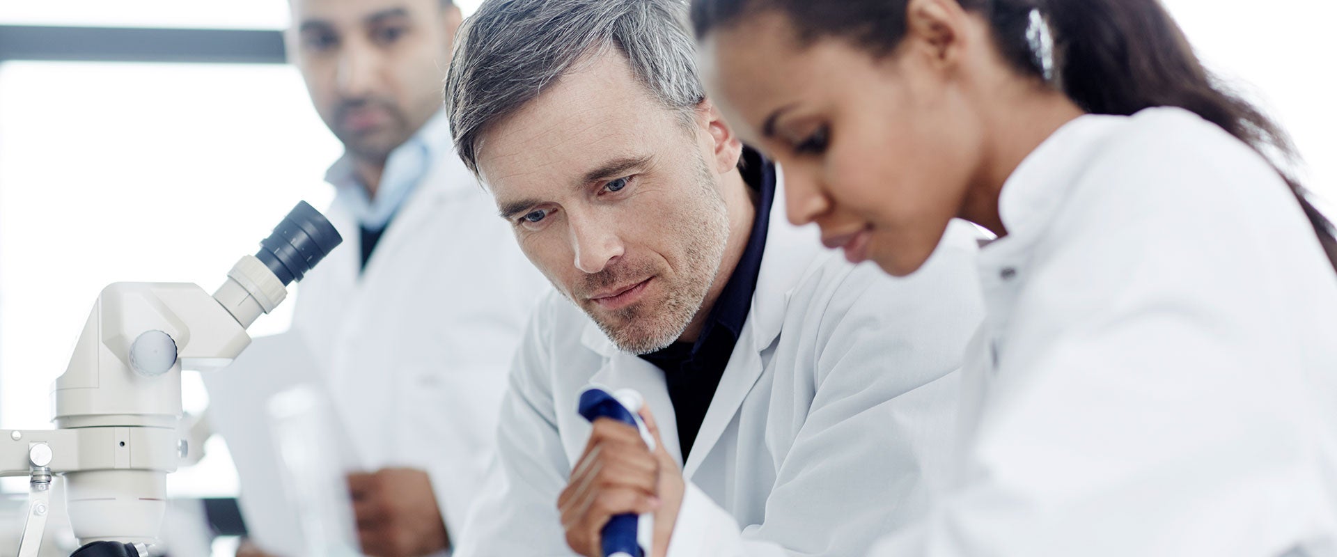 researchers pipetting