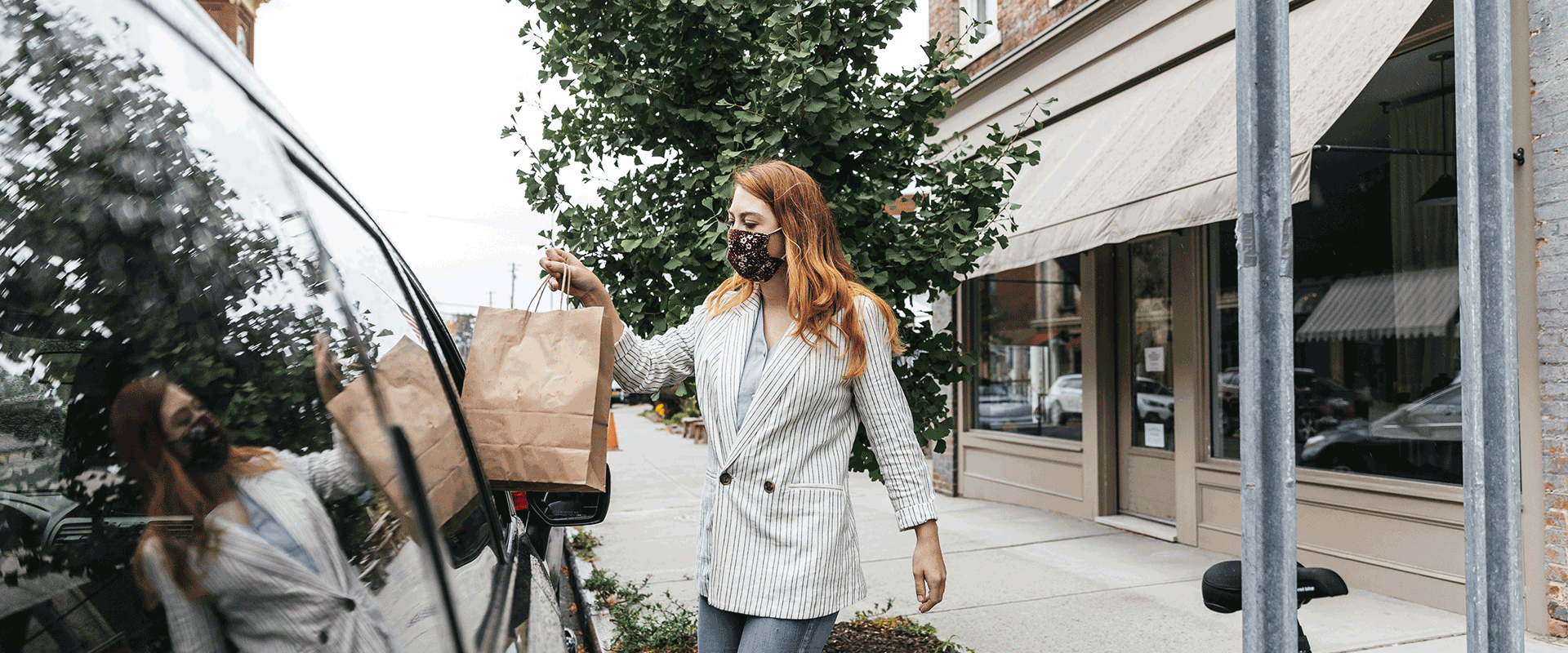 woman holds shopping bag