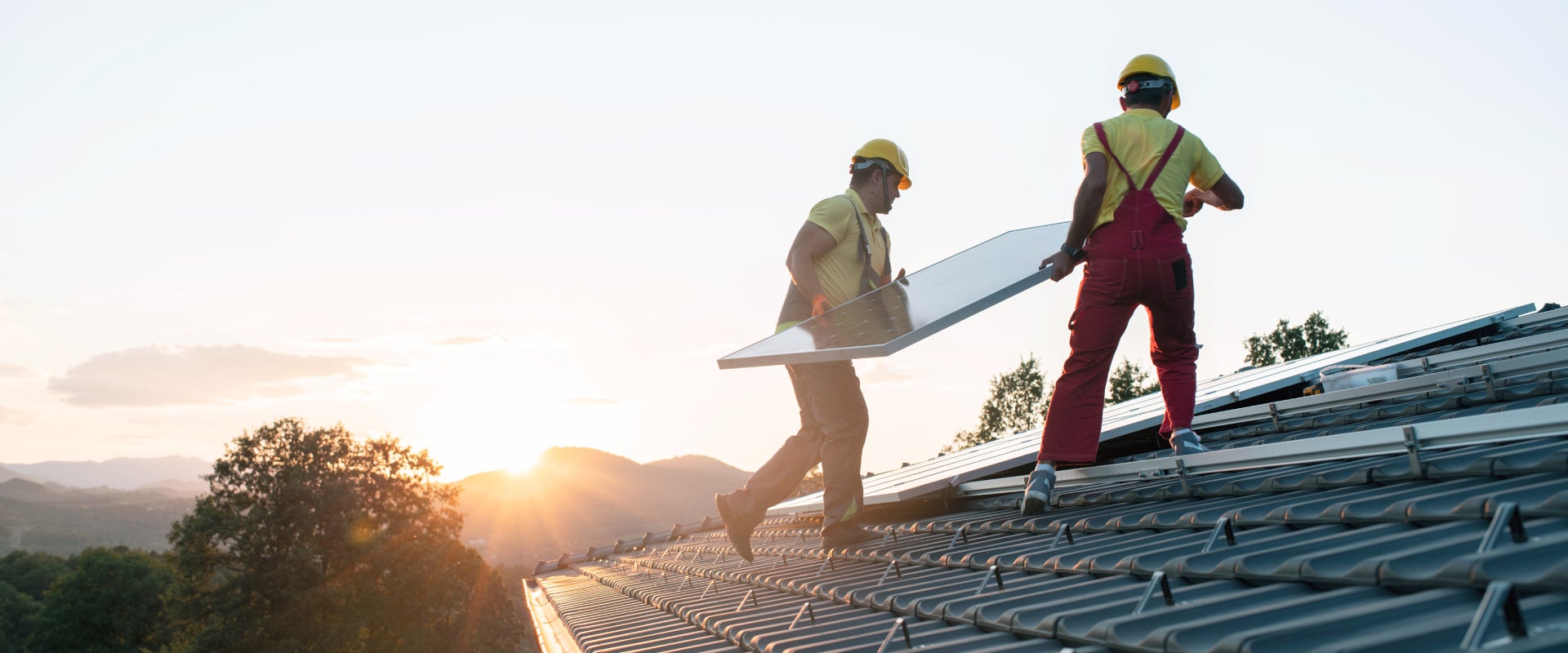 workers installing solar panels