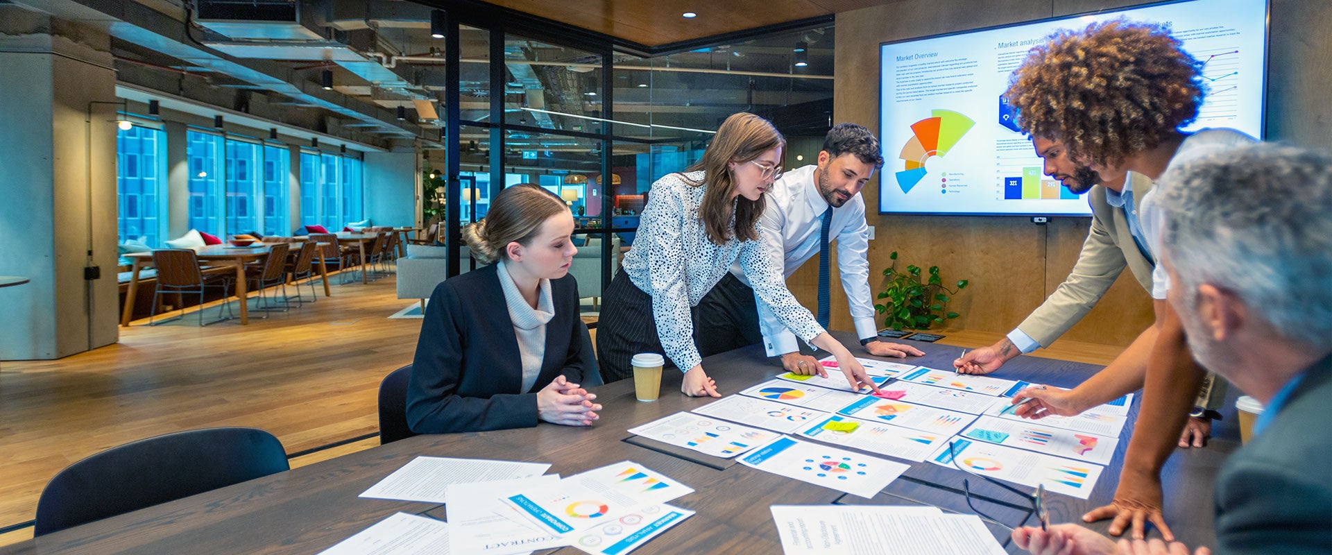 business meeting over charts