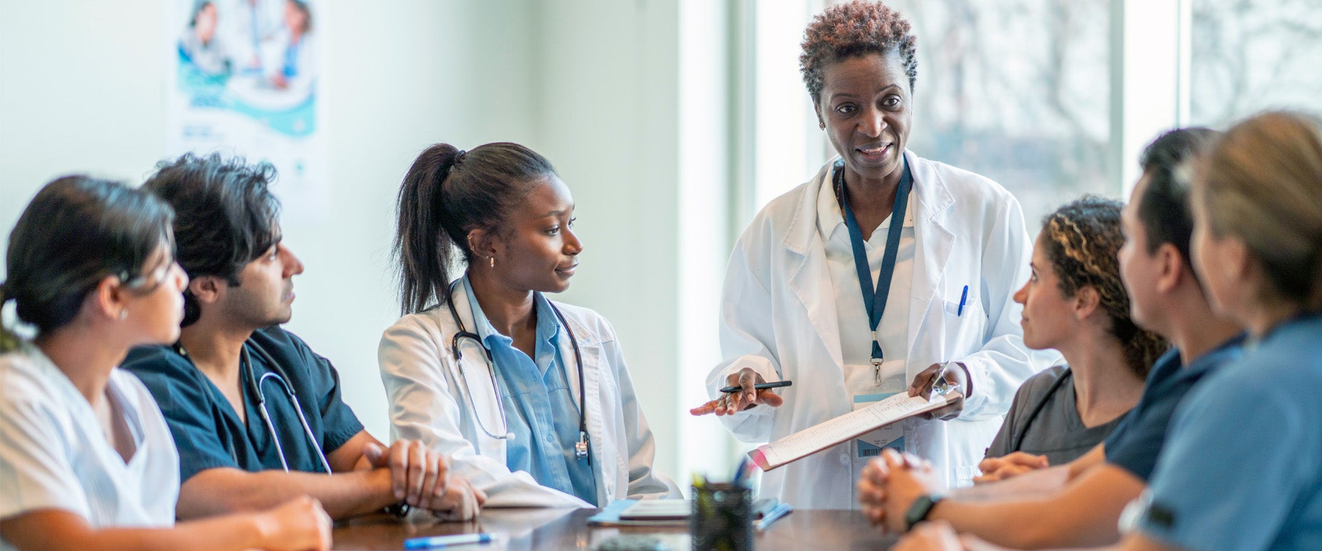 Head doctor conducting meeting