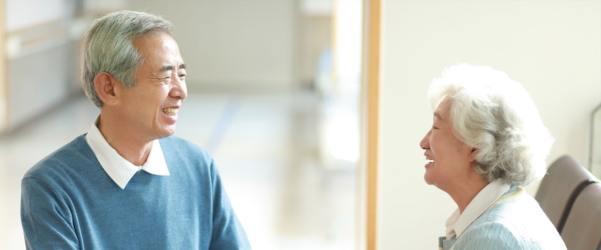 elderly couple smiling in hospital