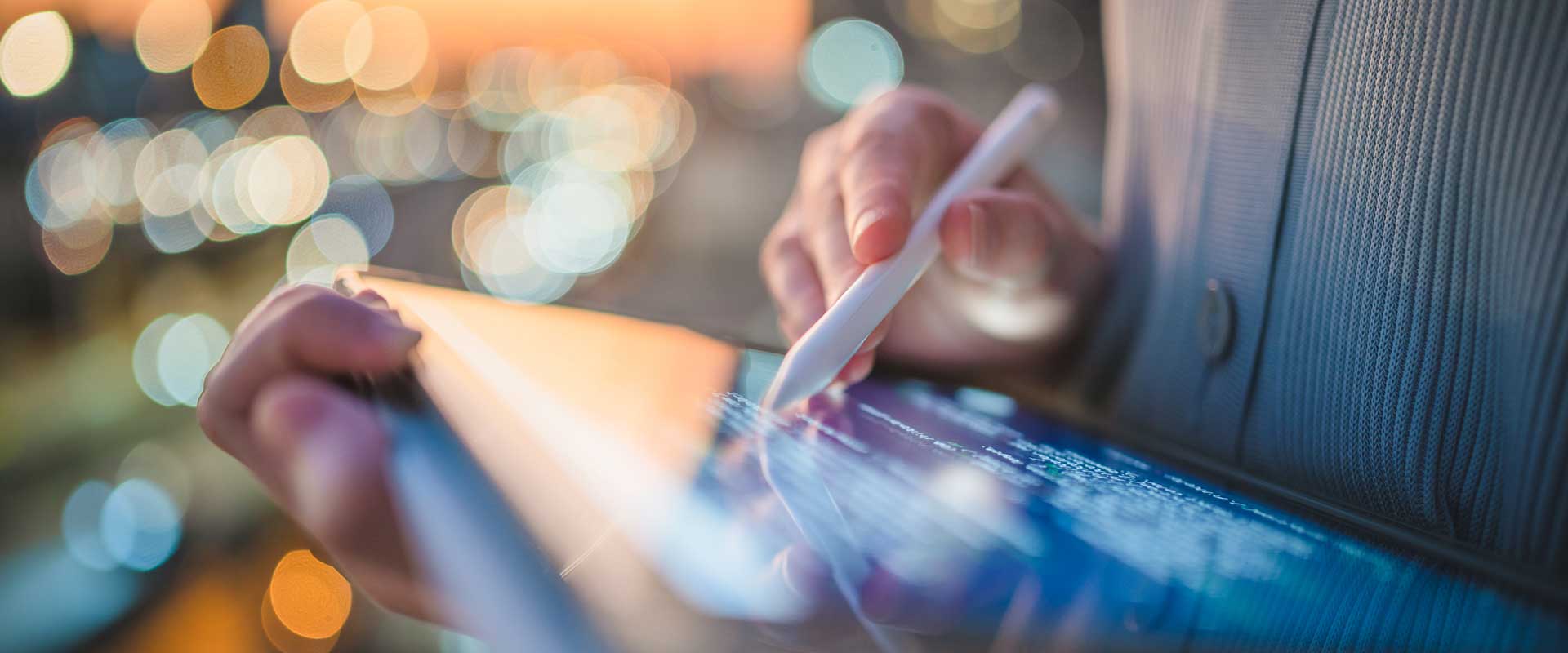 person writing on tablet