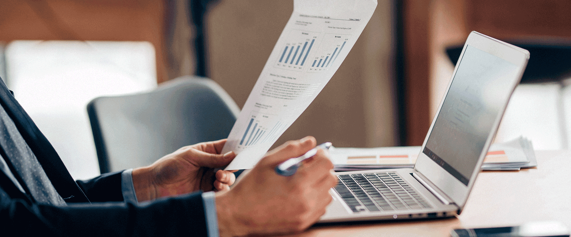 businessman holding papers