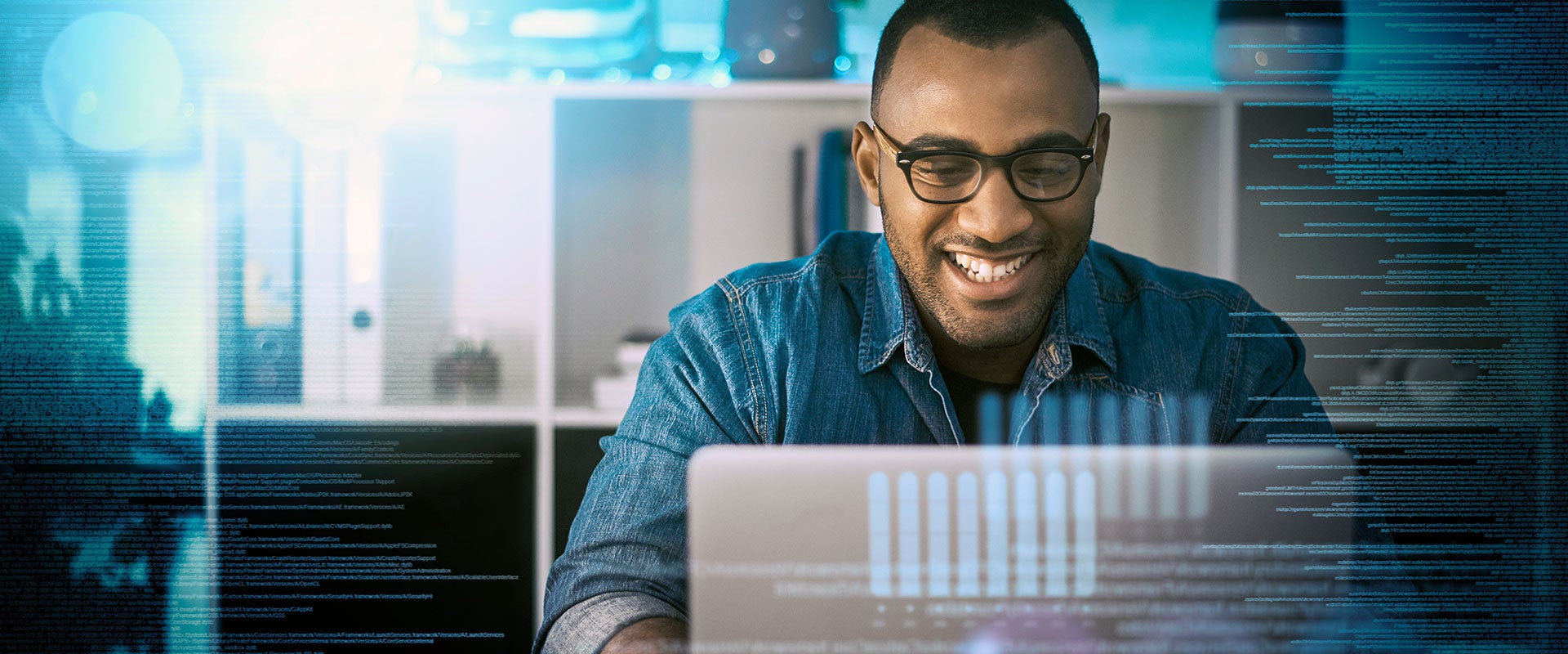 man smiling at laptop