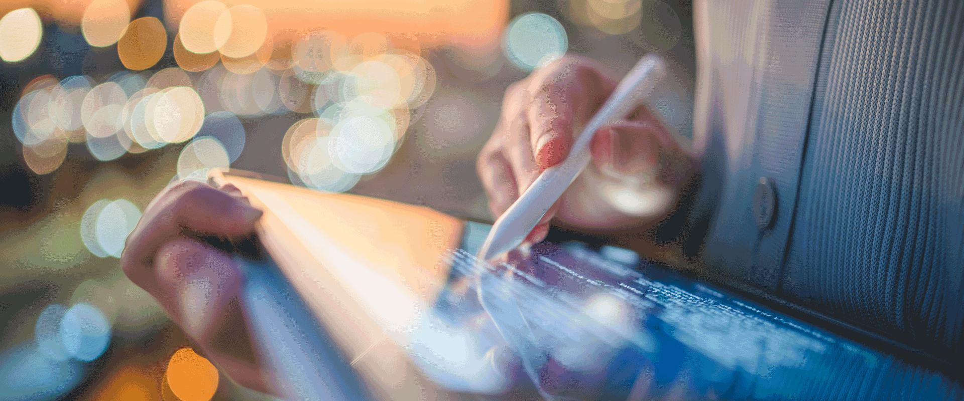person writing on tablet with stylus