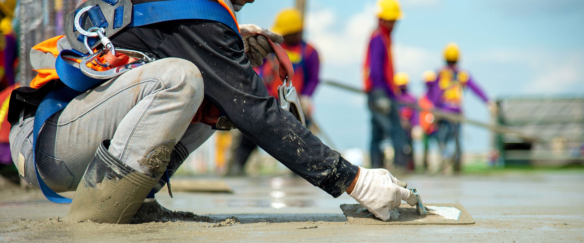 construction worker smoothing concrete