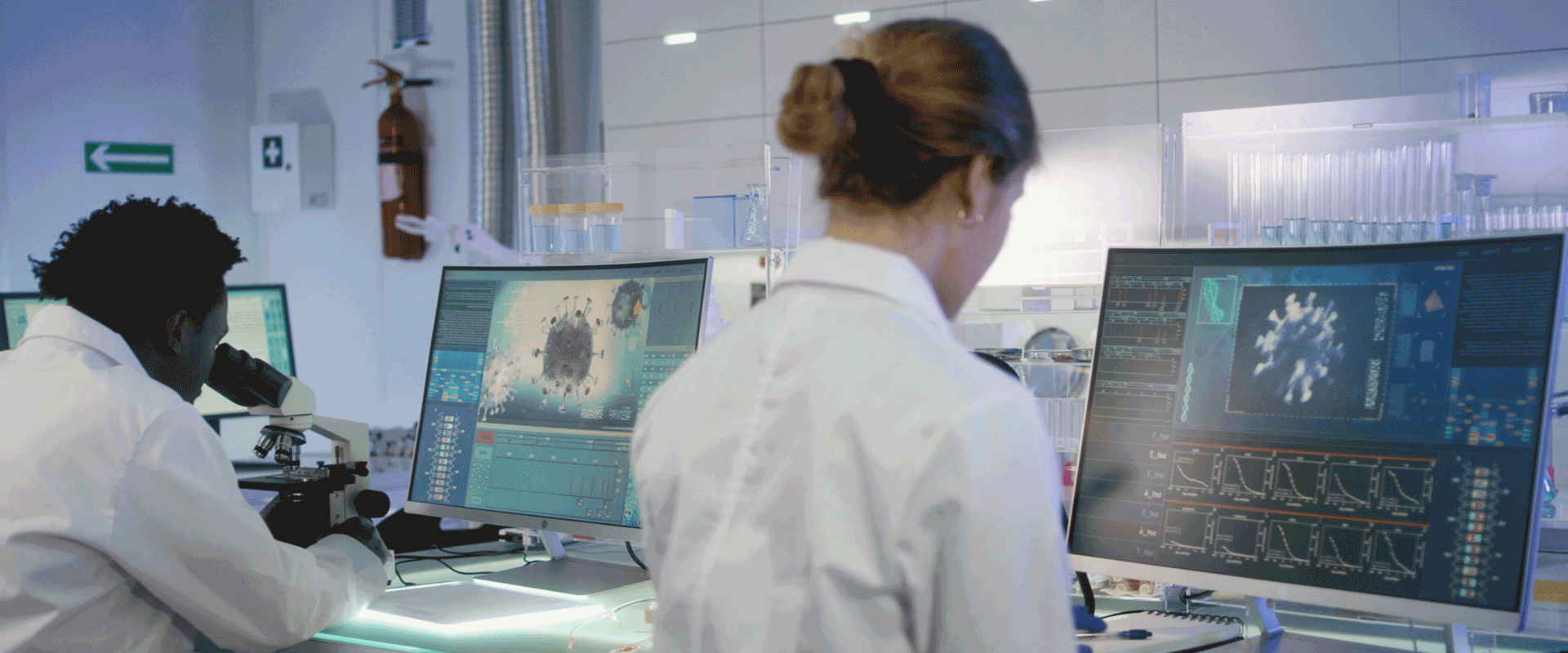 researchers reading data on computer