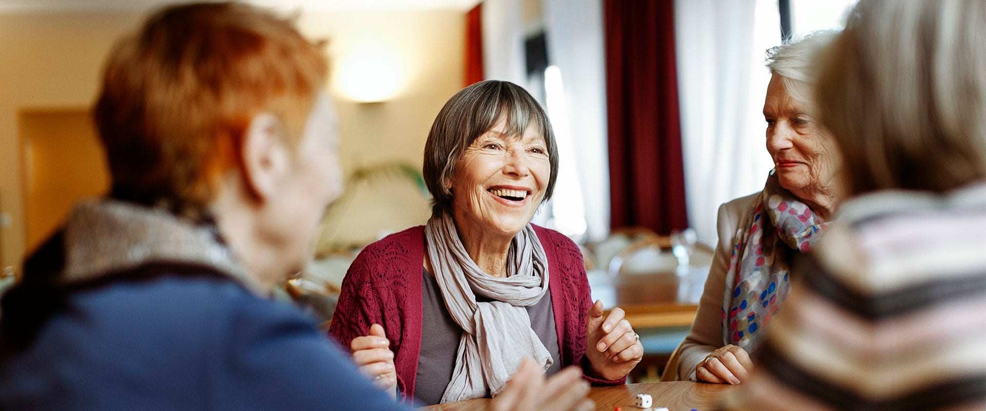 elderly women laughing together