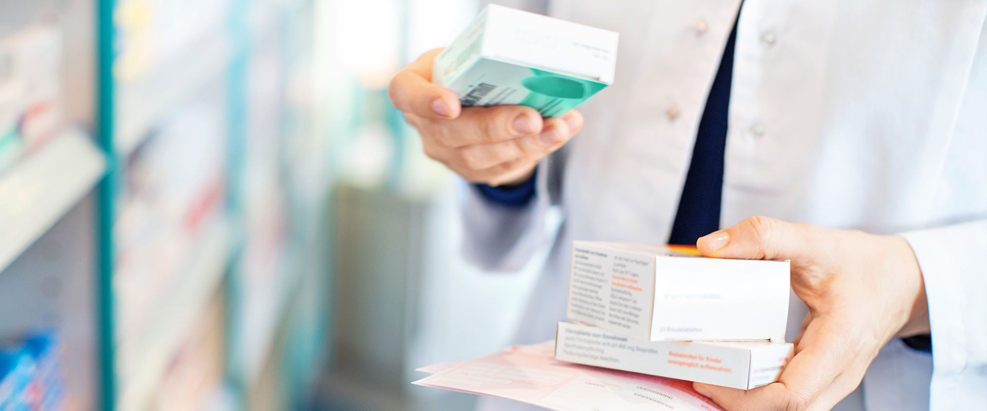 pharmacist holding medications