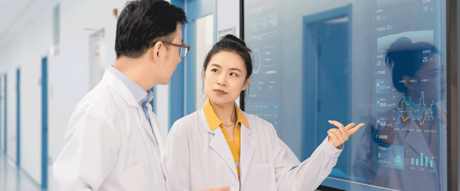 two researchers discussing data on board