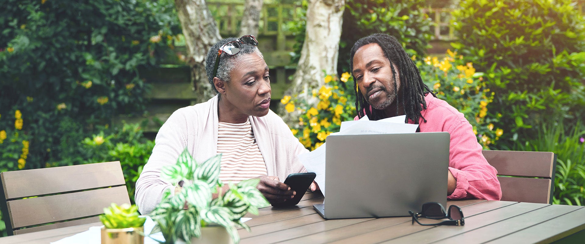 two people looking at laptop