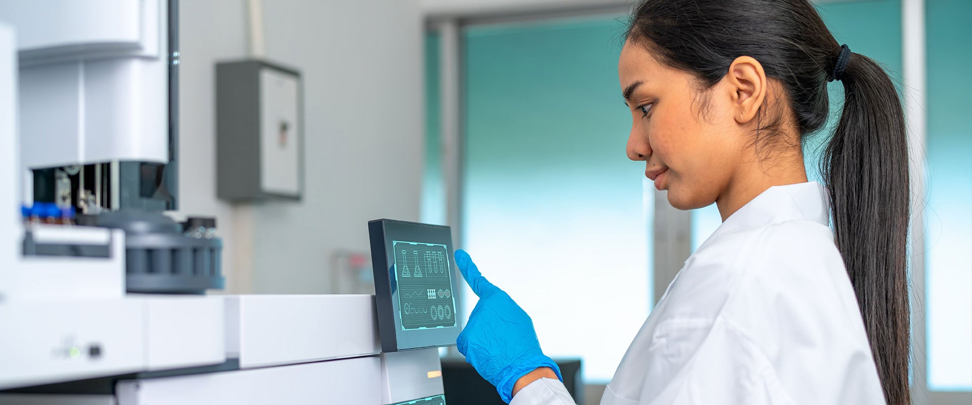 lab worker tapping screen