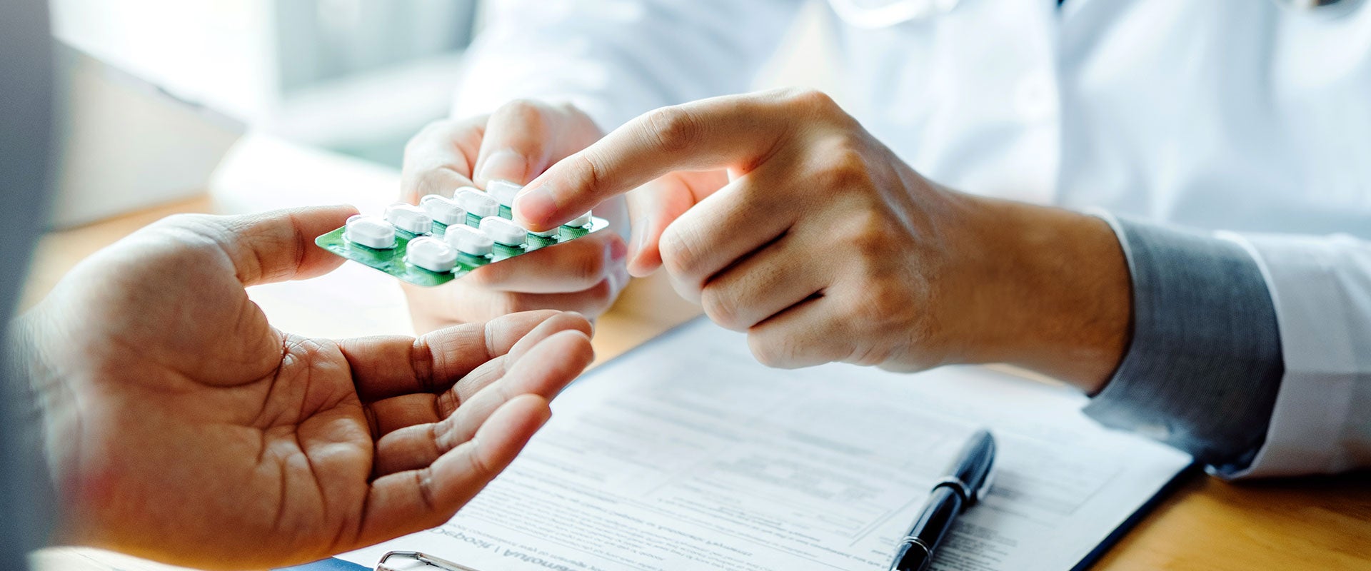 pharmacists holding pills
