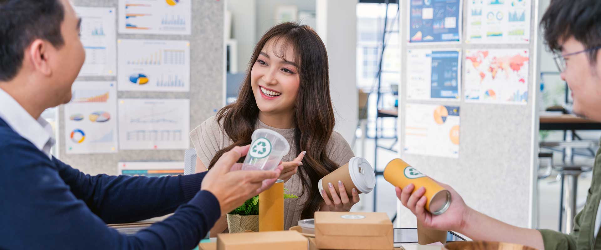smiling woman in business meeting with packages