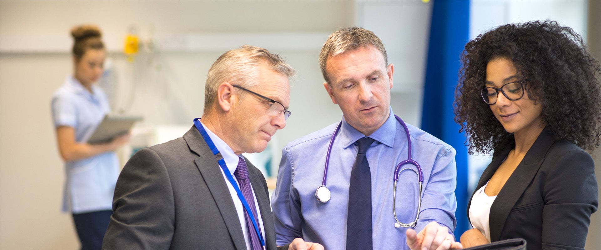 medical staff discussing documents