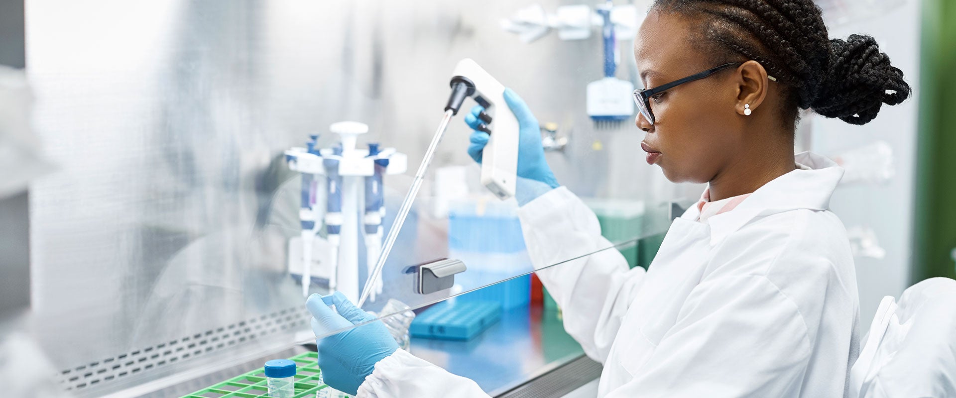 scientist pipetting liquids