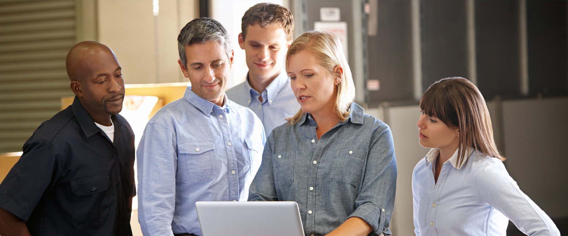 people looking at a laptop