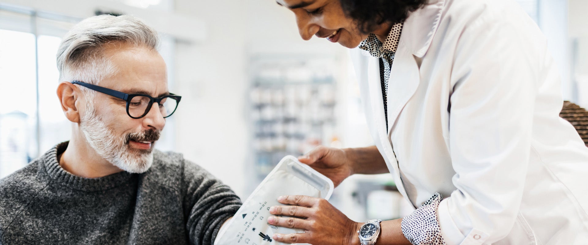 Medical professional take patient's blood pressure