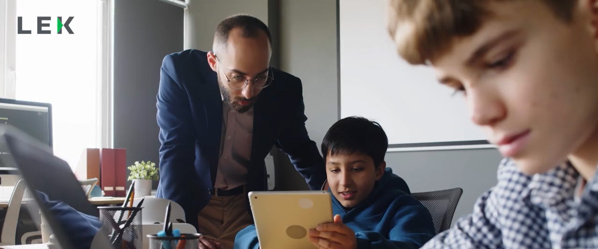 teacher helping young student